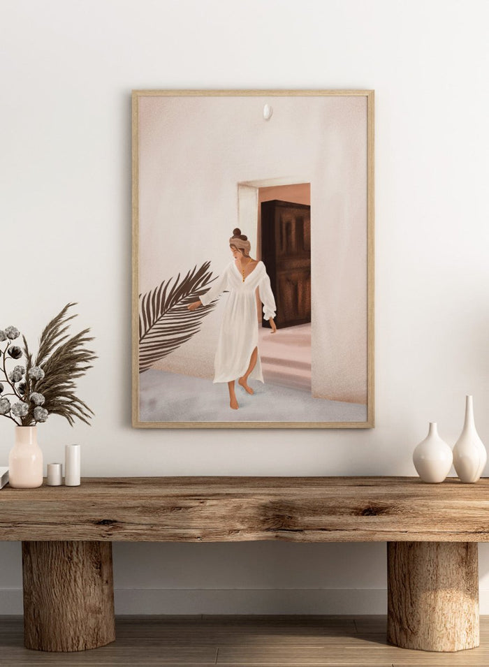 Woman in a white dress standing in a doorway with a palm leaf in the foreground. Woman With Palm Leaf by City Art is a modern figurative art print featuring a woman in a white dress, tropical greenery, warm neutrals, and Mediterranean style.