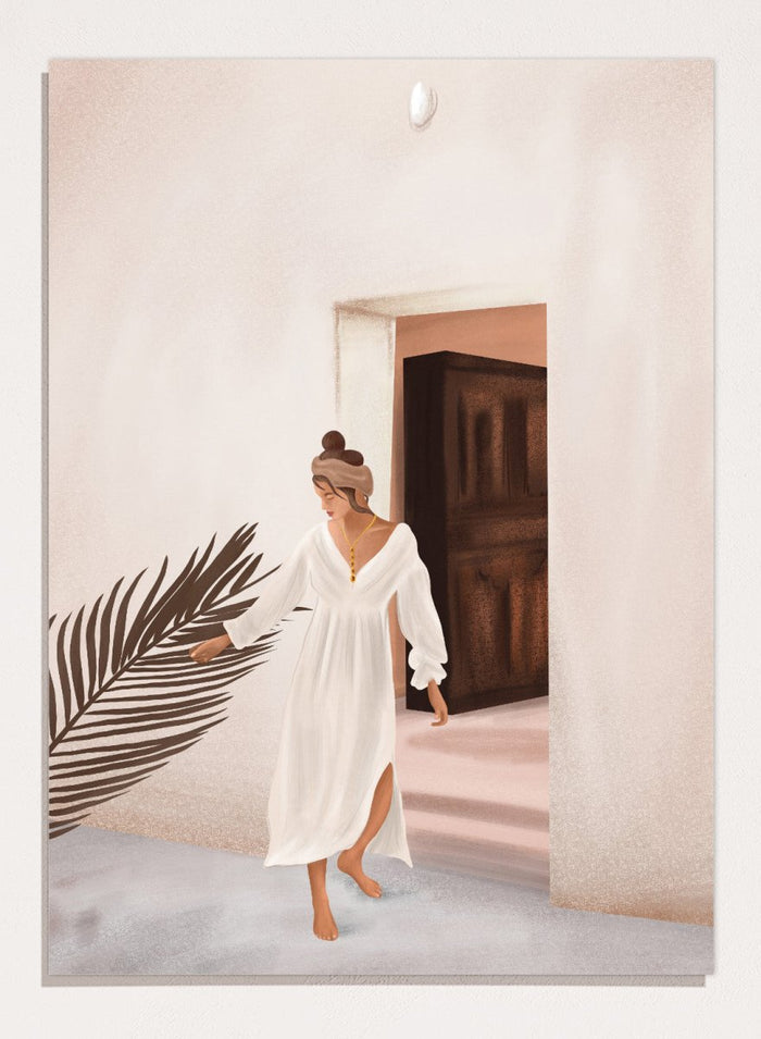 Woman in a white dress standing in a doorway with a palm leaf in the foreground. Woman With Palm Leaf by City Art is a modern figurative art print featuring a woman in a white dress, tropical greenery, warm neutrals, and Mediterranean style.
