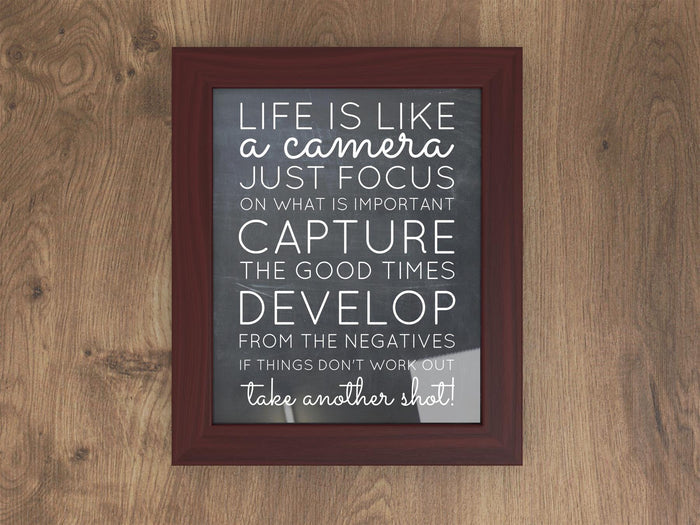 Mahogany picture frame featuring an inspirational quote about life, capturing moments, and taking another shot.