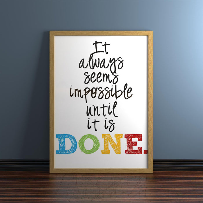 Inspirational quote in oak picture frame classic range with colorful lettering on a wall.