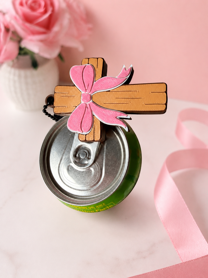 Cross with bow can tab opener