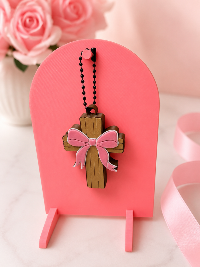 Cross with bow can tab opener
