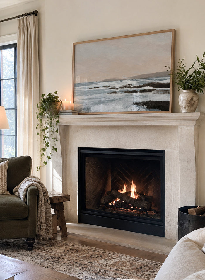 Shop Constantine Bay by Dan Hobday, a contemporary coastal wall art print with rocky shoreline, ocean waves, soft blue water, and warm beige-gray tones.