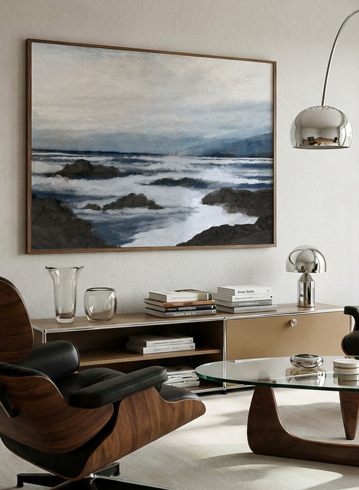 Shop Côte by Dan Hobday, a contemporary coastal wall art print featuring a moody ocean seascape, rocky shoreline, and layered blue-gray brushwork.