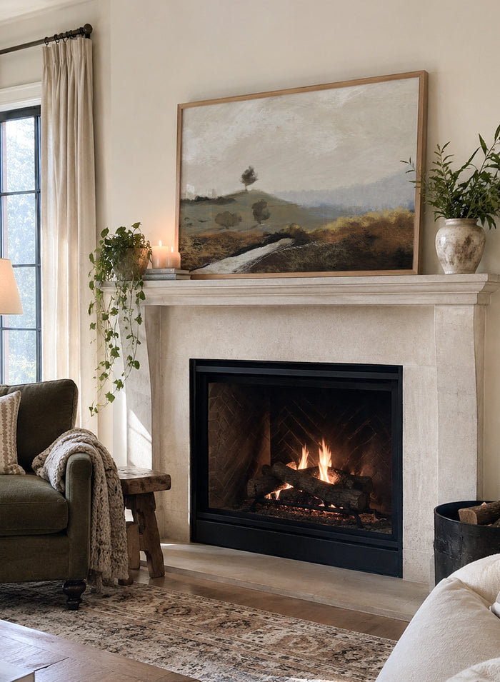 Shop La Collina by Dan Hobday, a contemporary landscape art print featuring rolling hills, scattered trees, earthy brown tones, and soft blue-gray distance.