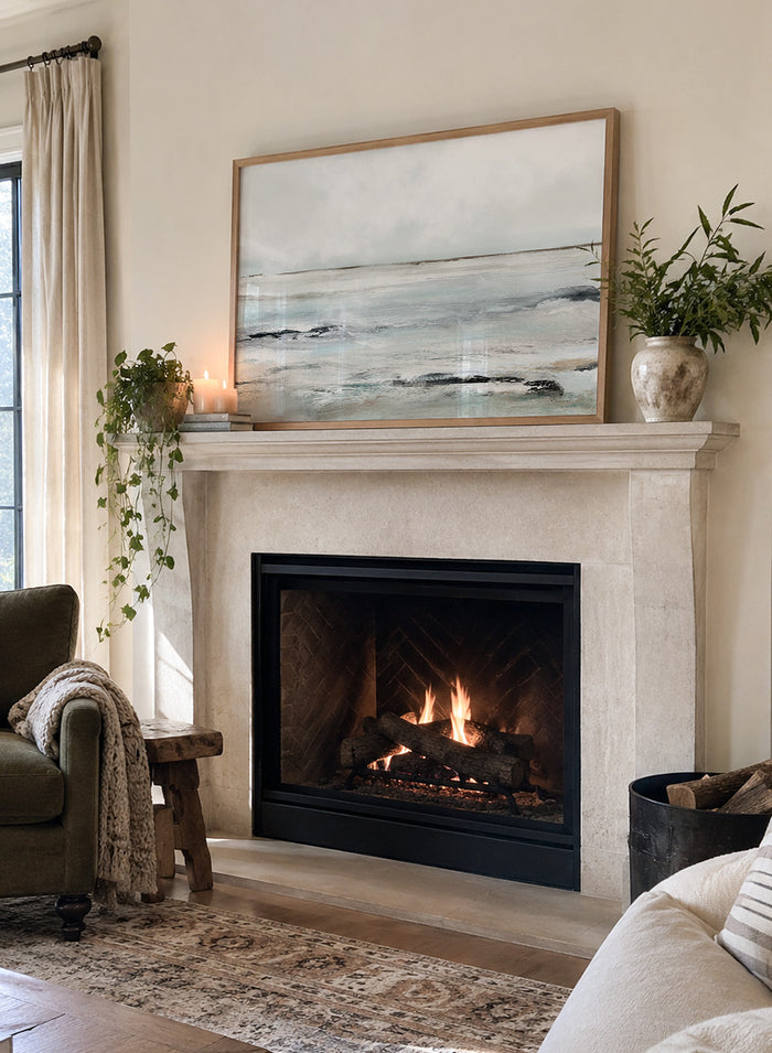 Shop Sandy Bay by Dan Hobday, a coastal landscape art print featuring soft blue-gray water, pale sky, textured shoreline, and layered neutral brushwork.