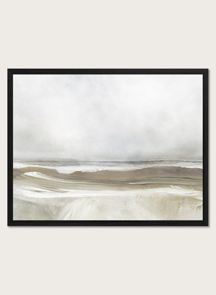 A framed abstract landscape art print depicting a misty beach scene with soft beige, gray, and white tones. Shop Sea Air by Dan Hobday, a contemporary coastal wall art print featuring ocean waves, a soft horizon, misty gray tones, and warm taupe brushwork.