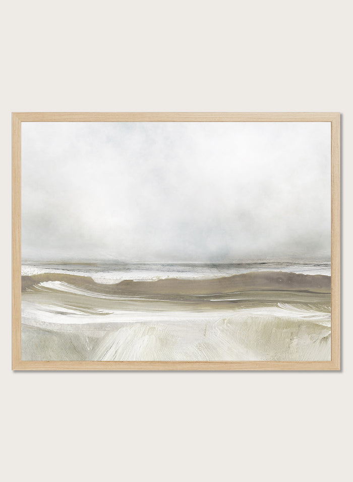 A framed abstract landscape art print depicting a misty beach scene with soft beige, gray, and white tones. Shop Sea Air by Dan Hobday, a contemporary coastal wall art print featuring ocean waves, a soft horizon, misty gray tones, and warm taupe brushwork.
