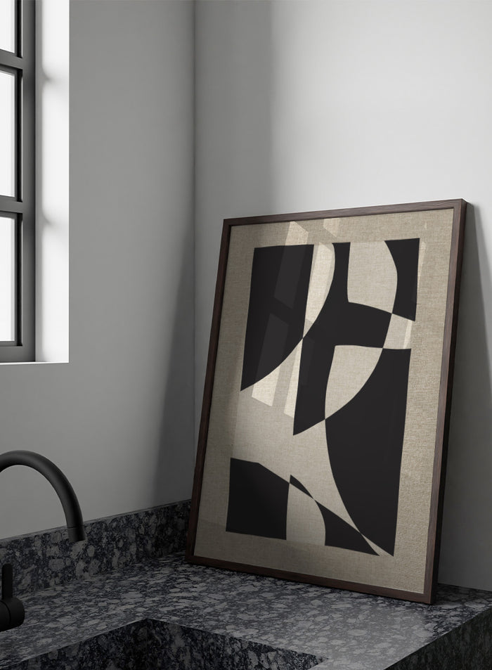 Abstract geometric wall art featuring bold black organic shapes over a warm beige linen-textured background. Shop Skära by Dan Hobday, a contemporary abstract wall art print featuring bold black geometric forms, curved shapes, and warm beige textured tones.