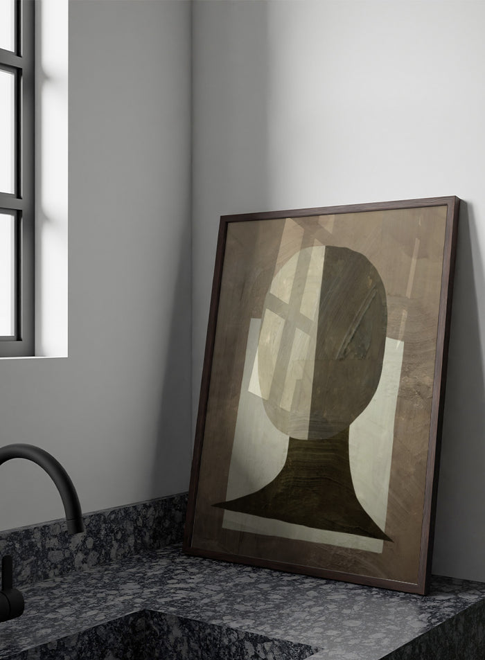 An abstract geometric art print featuring a stylized head and neck silhouette in shades of gray, brown, and off-white. Shop Study by Dan Hobday, a contemporary abstract portrait art print featuring a simplified human figure, geometric forms, and earthy brown and cream tones.
