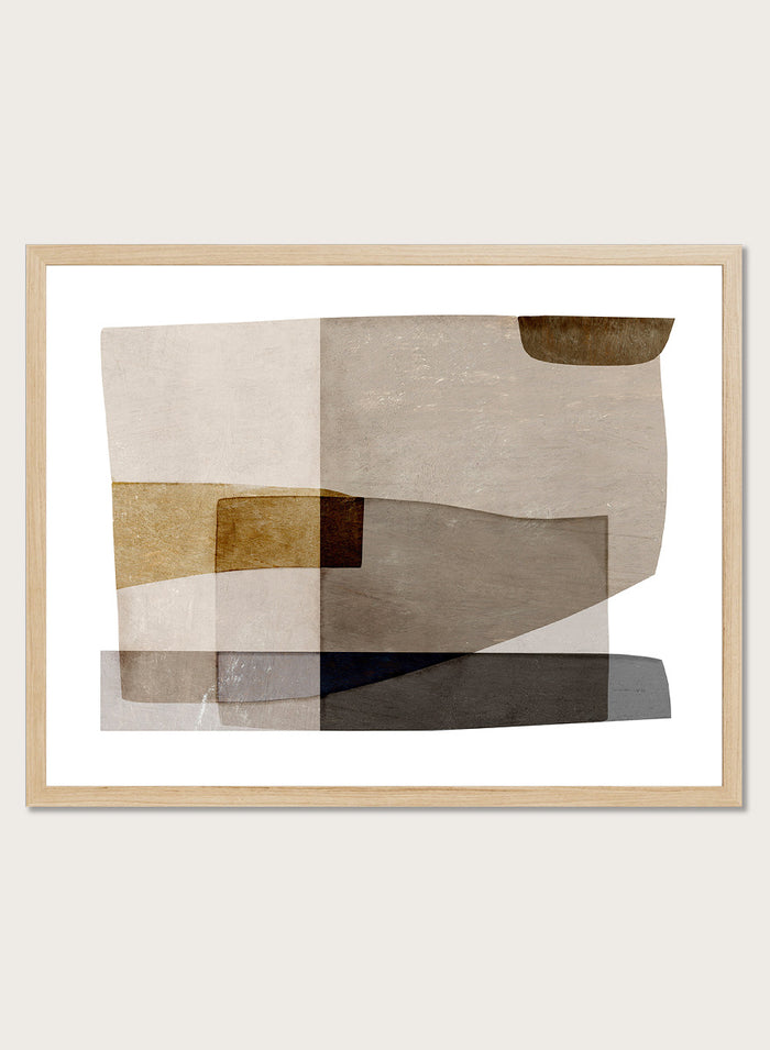 Framed abstract wall art featuring layered geometric shapes in beige, taupe, brown, gray, and black on a white mat, shown against a light warm gray background. Shop Transform by Dan Hobday, a contemporary abstract wall art print featuring layered geometric forms, soft brown and taupe tones, and textured neutral detail.