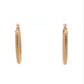 Diamond-Cut Oval Yellow Gold Hoop Earrings