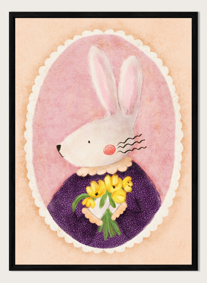A framed art print featuring a whimsical illustration of a white rabbit in a purple dress holding yellow flowers, set against a pink oval background. Shop Charming Bunny With Tulips by Dirkie Nell, a playful animal portrait art print featuring a white bunny, yellow tulips, purple dress, and soft pink tones.