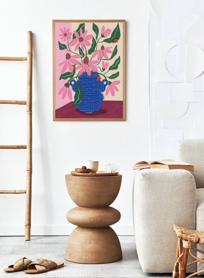 Artistic depiction of a blue vase with pink flowers on a pink background. Cone Flowers in a Pot by Dirkie Nell is a colorful floral art print with pink blooms, butterflies, and a bold blue vase. Officially licensed wall poster.