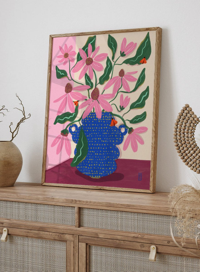 Artistic depiction of a blue vase with pink flowers on a pink background. Cone Flowers in a Pot by Dirkie Nell is a colorful floral art print with pink blooms, butterflies, and a bold blue vase. Officially licensed wall poster.