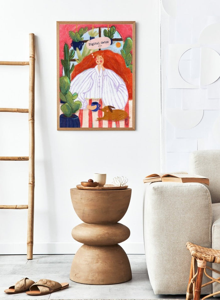 Illustration of a woman with red hair in a white shirt, sitting with a cup and a dog, surrounded by cacti with a 'Digital Detox' speech bubble. Digital Detox Morning by Dirkie Nell is a contemporary lifestyle art print featuring hand painted cacti, a sleepy dog, coffee, and colorful modern illustration details.