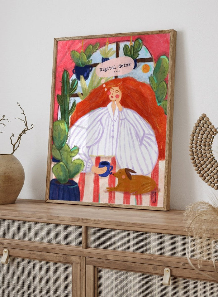 Illustration of a woman with red hair in a white shirt, sitting with a cup and a dog, surrounded by cacti with a 'Digital Detox' speech bubble. Digital Detox Morning by Dirkie Nell is a contemporary lifestyle art print featuring hand painted cacti, a sleepy dog, coffee, and colorful modern illustration details.