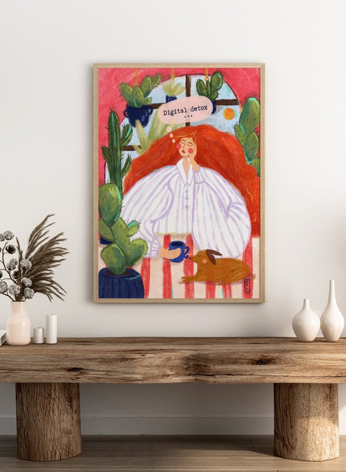 Illustration of a woman with red hair in a white shirt, sitting with a cup and a dog, surrounded by cacti with a 'Digital Detox' speech bubble. Digital Detox Morning by Dirkie Nell is a contemporary lifestyle art print featuring hand painted cacti, a sleepy dog, coffee, and colorful modern illustration details.