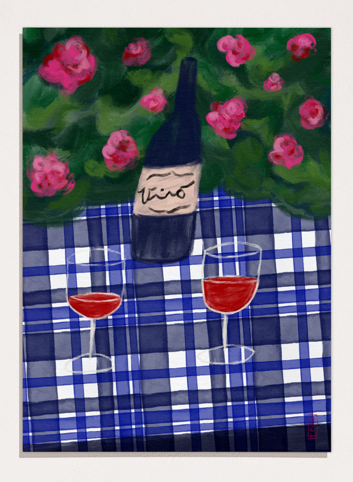 A painted still life scene featuring a dark wine bottle labeled 'vino' on a blue-and-white plaid tablecloth, with two glasses of red wine and pink flowers against a green background. Shop Garden Wine Picnic by Dirkie Nell, a colorful still life art print featuring red wine, blue gingham, pink roses, and a warm summer garden mood.