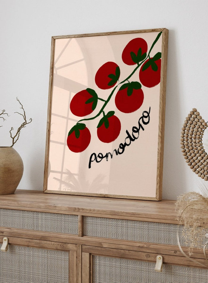 Illustration of red tomatoes on a branch with ' pomodoro' text on a beige background. Italian Pomodoro Tomatoes by Dirkie Nell is a contemporary food art print featuring hand painted red tomatoes, playful typography, and colorful Mediterranean inspired style.