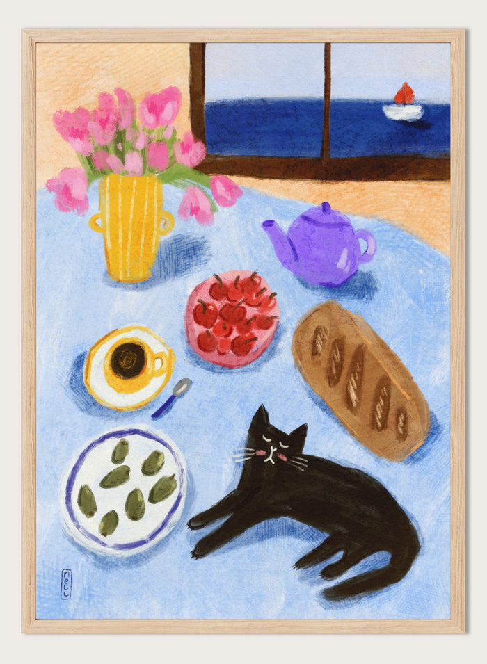 A colorful still life painting of a table scene with pink tulips in a yellow vase, a purple teapot, a bowl of strawberries, a cup of coffee, a loaf of bread, a black cat, and a window view of the sea with a small sailboat. Shop Relaxing Seaside Cat Breakfast by Dirkie Nell, a playful cat and food art print featuring breakfast, flowers, a sailboat, and a seaside view.