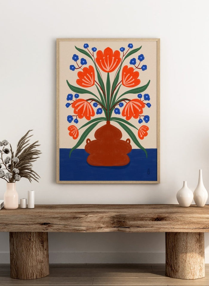 Vibrant Floral Terracotta Vase by Dirkie Nell is a colorful floral art print featuring bold orange flowers, folk inspired illustration, Mediterranean decor, and modern botanical wall art.