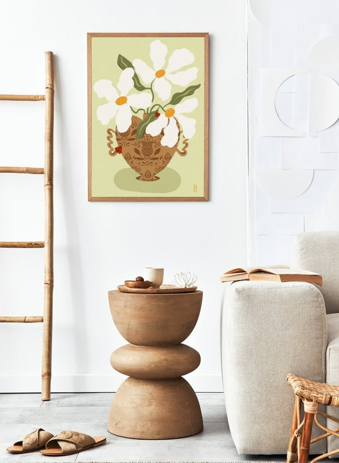 Decorative illustration of a vase with white flowers on a light green background. Whimsical Floral Heart by Dirkie Nell is a floral art print featuring oversized white flowers, a patterned heart vase, and hand painted folk inspired details.