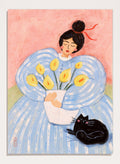 A stylized painting of a woman in a voluminous light blue dress holding a white vase with yellow flowers, with a black cat at her side against a pink background. Woman With Flowers And Cat by Dirkie Nell is a colorful portrait and floral art print featuring a woman, yellow flowers, blue dress, and black cat.