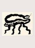Framed artwork of a black and white creature with cat-like features and snake-like body. I Am Animals by Eden Kalif is a modern minimalist line art print featuring abstract animal forms in a bold black and white contemporary wall poster design.