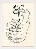 Black line drawing of a hand holding a flower on a beige background. Let It Grow by Eden Kalif is a modern line art print featuring a hand holding a flower with a human figure, designed as a minimalist contemporary wall poster.