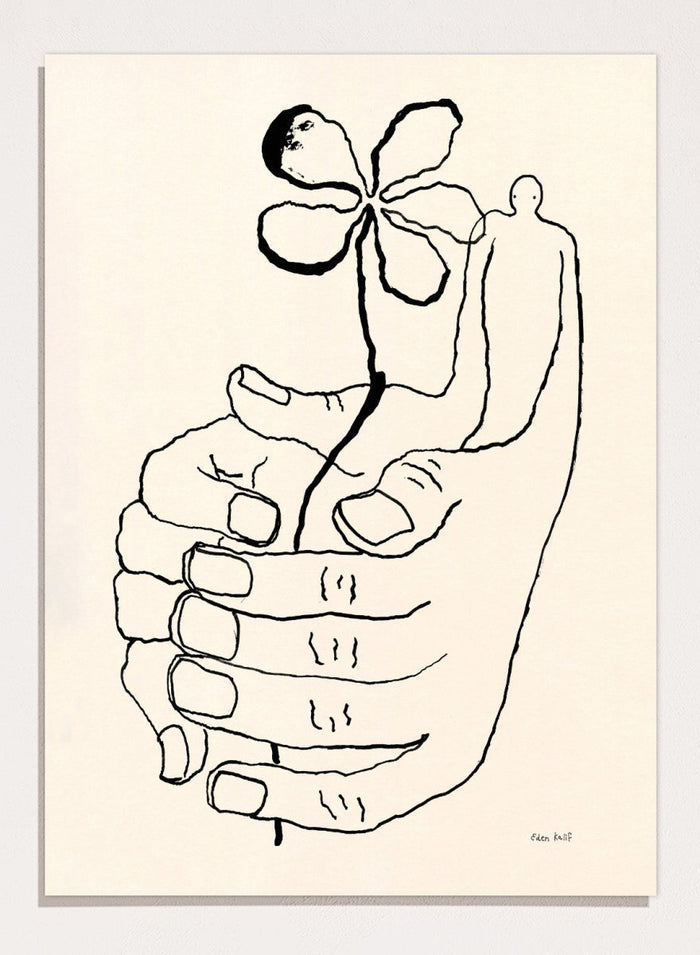 Black line drawing of a hand holding a flower on a beige background. Let It Grow by Eden Kalif is a modern line art print featuring a hand holding a flower with a human figure, designed as a minimalist contemporary wall poster.