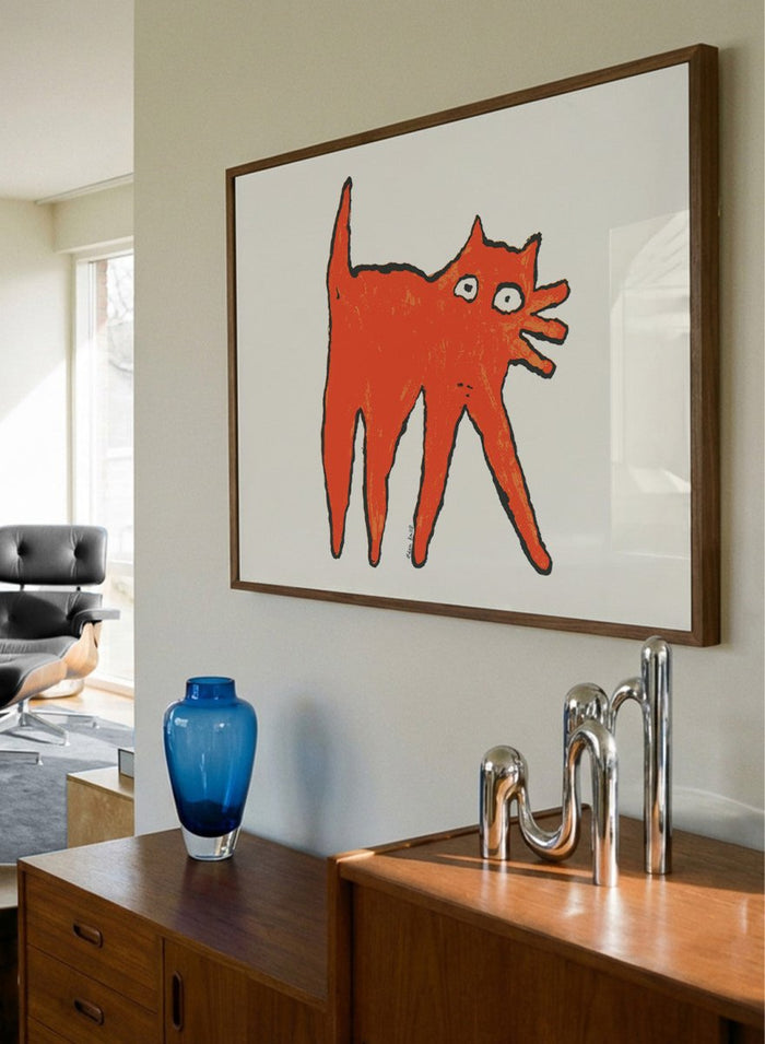 Framed illustration of a orange cat on a white background. Orange Cat by Eden Kalif is a modern cat art print in bold orange, a contemporary minimalist wall poster with playful form and expressive line work.
