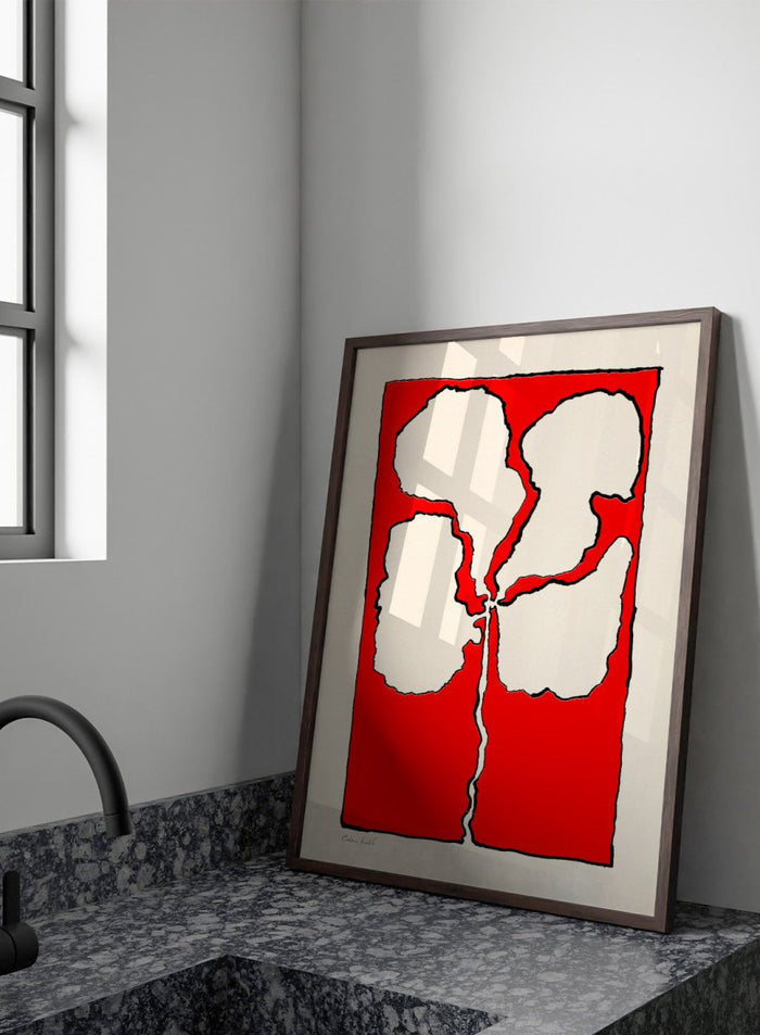Abstract floral artwork with white shapes on a red background. Red Flower by Eden Kalif is a modern floral art print featuring bold red background and abstract flower form in a contemporary graphic wall poster design.