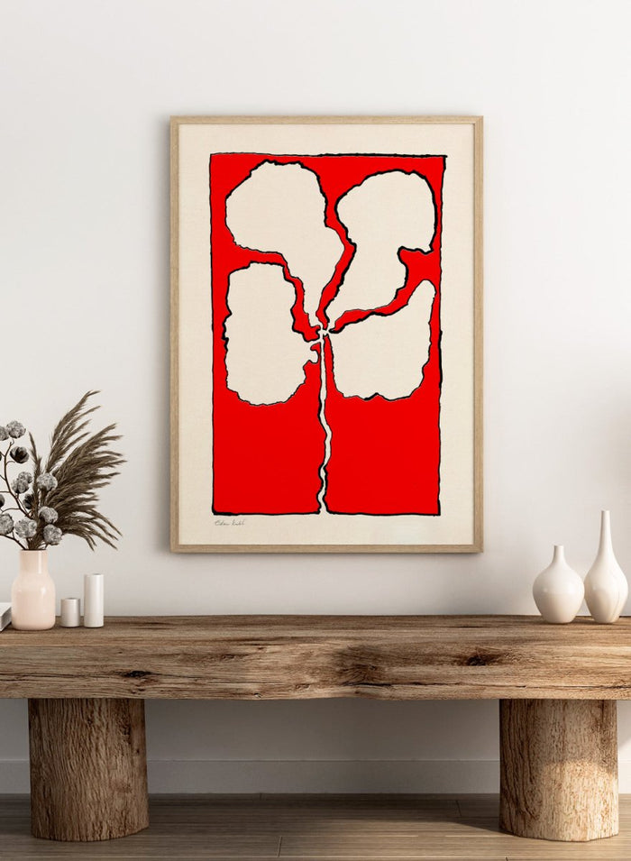 Abstract floral artwork with white shapes on a red background. Red Flower by Eden Kalif is a modern floral art print featuring bold red background and abstract flower form in a contemporary graphic wall poster design.