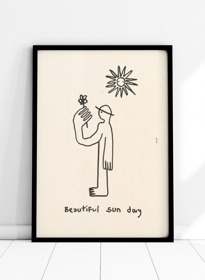 Black line drawing of a person with a flower and a sun, with 'Beautiful sun day' text on a beige background. Untitled by Eden Kalif is a modern line art print of a figure holding a flower under the sun, a contemporary minimalist wall poster with simple expressive drawing.