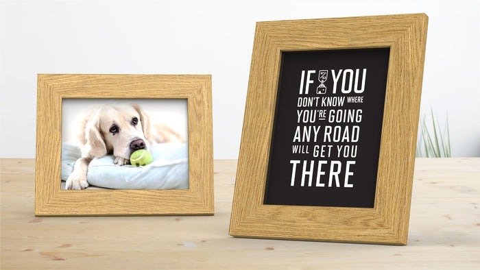 Two oak picture and poster frames displaying a photo of a dog and a motivational quote, enhancing any decor.