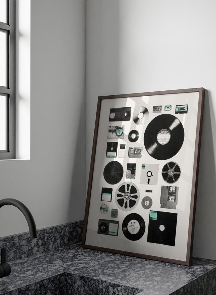Collection of vintage audio and video equipment on a white background. Analog Digital Memories by Florent Bodart is a retro media art print featuring vinyl, cassette, and floppy disks, a modern wall poster exploring analog and digital design.
