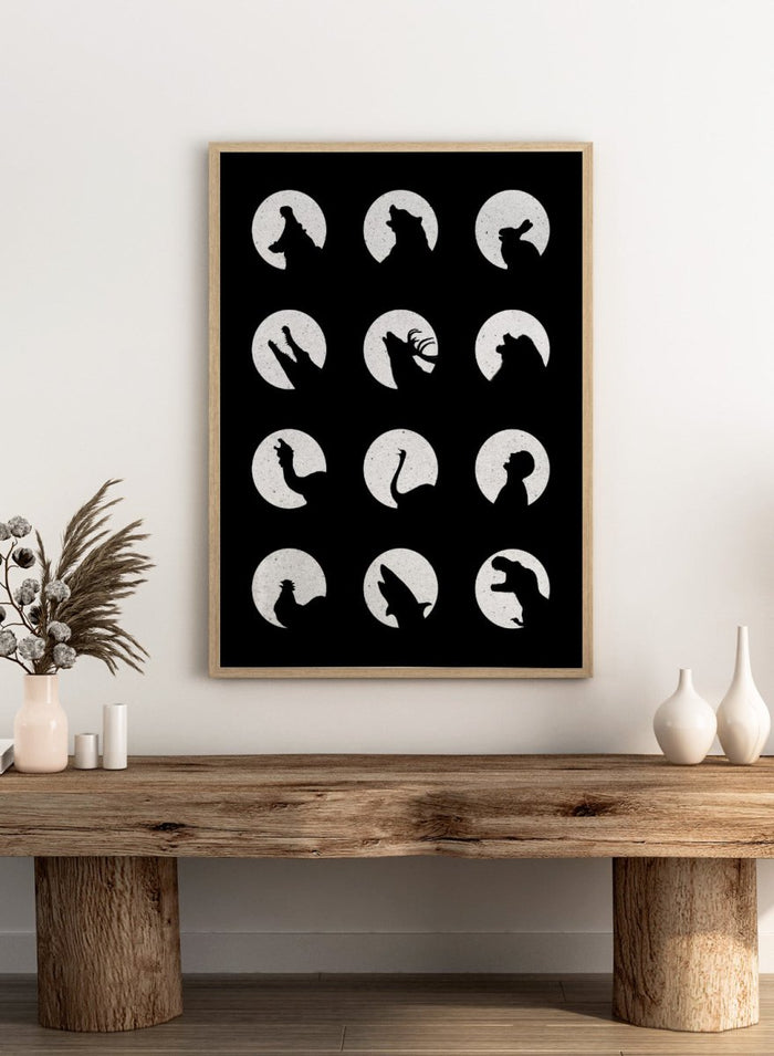 White silhouette of a dog howling at the moon pattern on a black background. Moonlit Wild Silhouettes by Florent Bodart is a minimalist animal silhouette art print with moon phases, a modern black wall poster with bold graphic design.