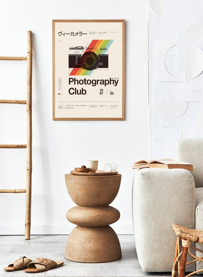 Poster of a camera with a rainbow stripe and text about a photography club. Retro Photography Club by Florent Bodart is a vintage camera art print with bold color and typography, a modern retro wall poster inspired by classic photography design.