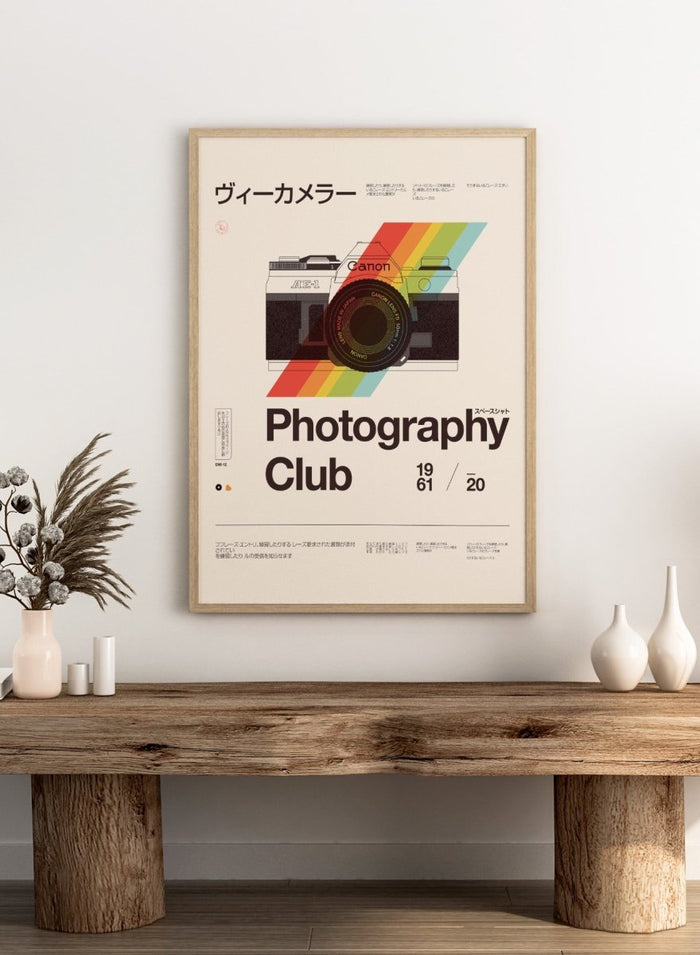 Poster of a camera with a rainbow stripe and text about a photography club. Retro Photography Club by Florent Bodart is a vintage camera art print with bold color and typography, a modern retro wall poster inspired by classic photography design.