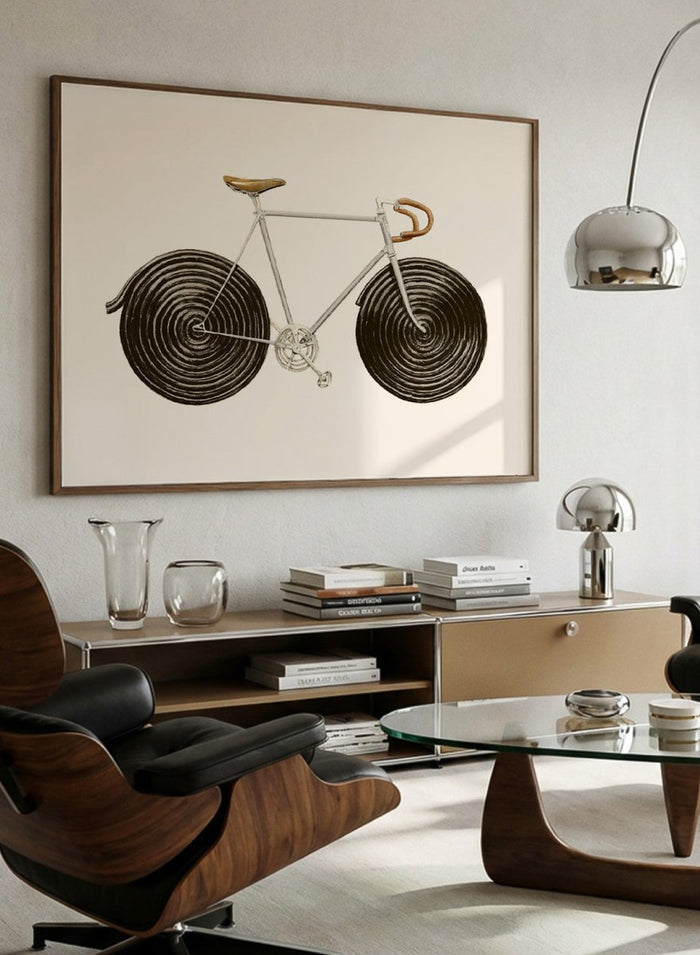 Framed artwork of a bicycle with spiral wheels on a beige background. Sweet Licorice Bicycle by Florent Bodart is a surreal bicycle art print with playful design and vintage style, a modern wall poster with creative and unique concept.
