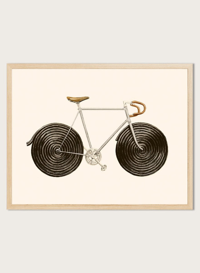 Framed artwork of a bicycle with spiral wheels on a beige background. Sweet Licorice Bicycle by Florent Bodart is a surreal bicycle art print with playful design and vintage style, a modern wall poster with creative and unique concept.