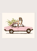 Framed artwork of a tiger in a pink car with greenery on a white background. Tiger On Pink Car by Florent Bodart is a surreal animal art print with a tiger on a vintage car, a modern wall poster with playful, bold, and imaginative design.