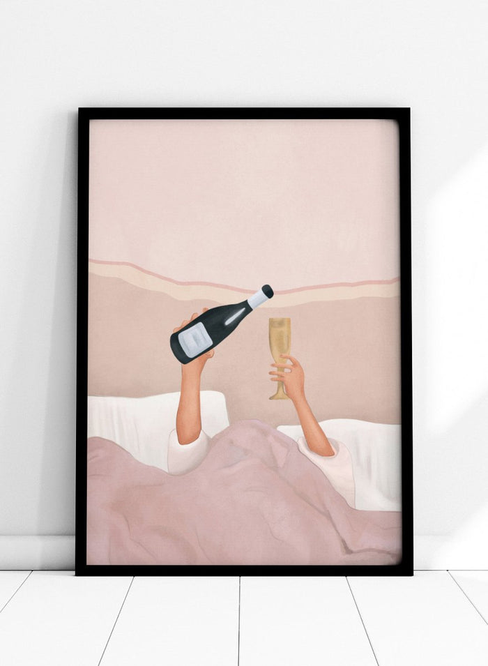 Illustration of a person lying in bed holding a bottle and a glass, with a soft pink background. Champagne In Bed by Flow Line is a playful bedroom art print featuring champagne, pink bedding, and slow mornings, perfect for modern and feminine interiors.