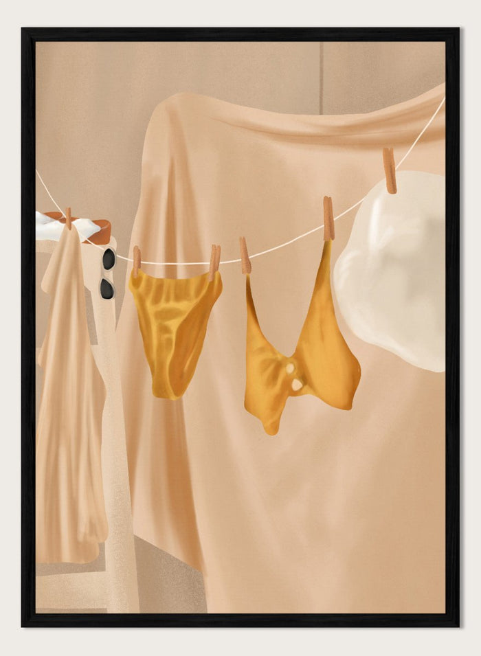 Yellow bikini top and bottom hanging on a clothesline against a beige background. Golden Summer Laundry by Flow Line is a summer art print featuring hanging linens, a yellow swimsuit, sun hat, and Mediterranean-inspired coastal decor.
