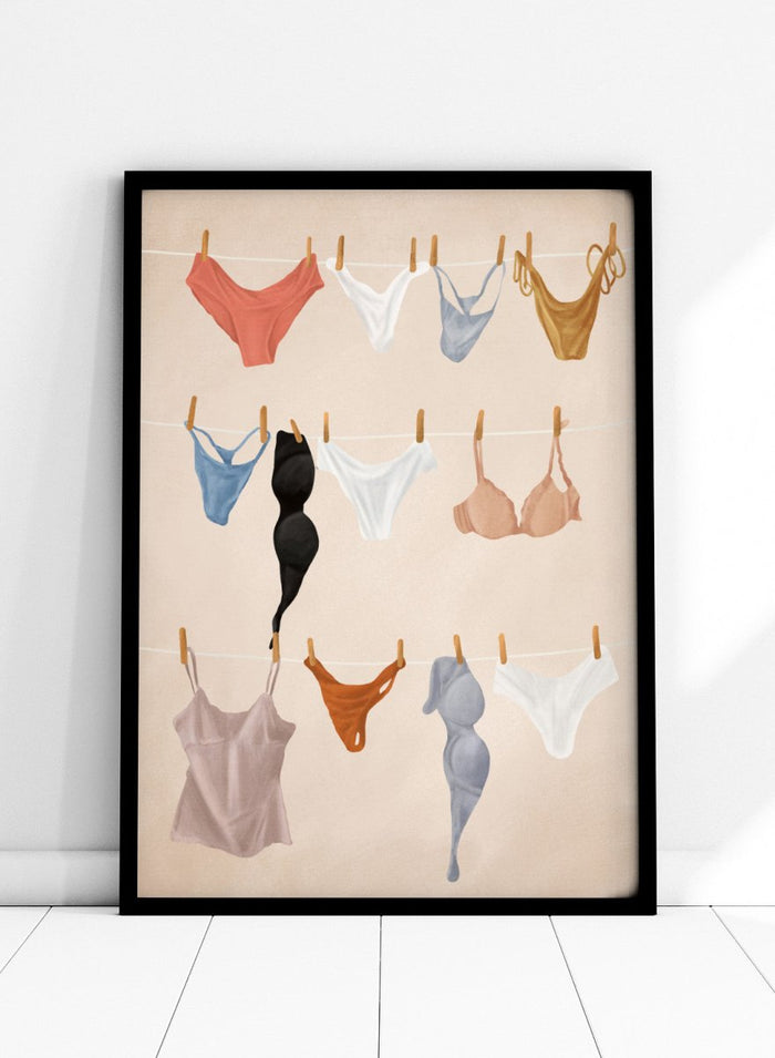 Colorful lingerie hanging on a line against a beige background. Lingerie On The Line by Flow Line is a playful summer art print featuring colorful garments drying in the sun, perfect for bedrooms, dressing rooms, and modern interiors.