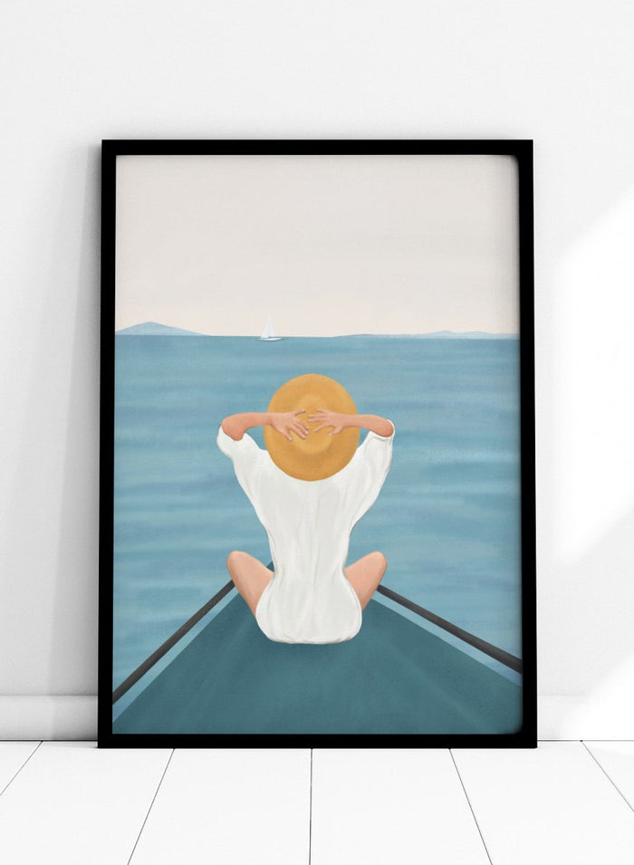 Person sitting on a dock over water wearing a white dress and straw hat. Ocean Escape by Flow Line features a woman sitting on a boat overlooking the sea, creating a coastal art print inspired by travel, summer, and ocean living.