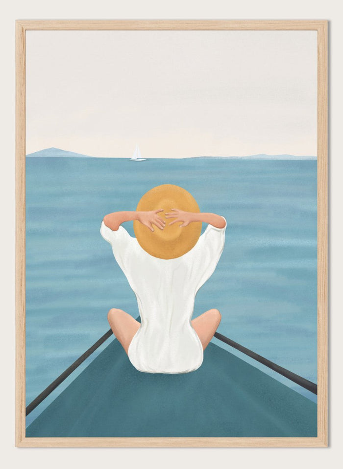Person sitting on a dock over water wearing a white dress and straw hat. Ocean Escape by Flow Line features a woman sitting on a boat overlooking the sea, creating a coastal art print inspired by travel, summer, and ocean living.