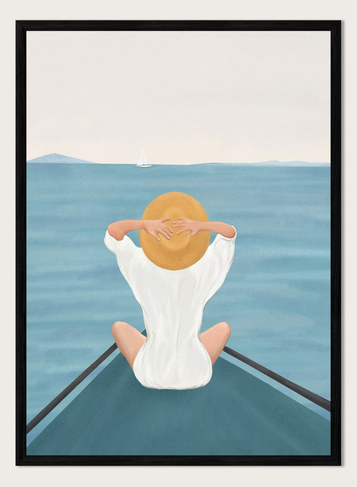 Person sitting on a dock over water wearing a white dress and straw hat. Ocean Escape by Flow Line features a woman sitting on a boat overlooking the sea, creating a coastal art print inspired by travel, summer, and ocean living.