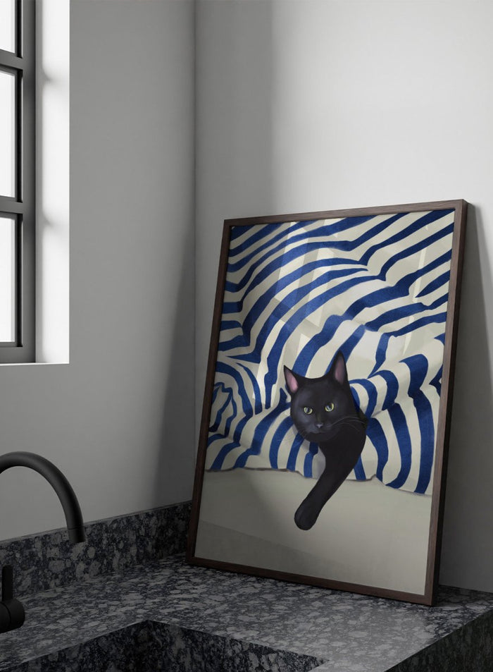 Black cat peeking out from behind a blue and white striped fabric. Peeking Black Cat by Flow Line features a mischievous black cat among striped cushions, adding playful cat art and modern coastal style to your home.